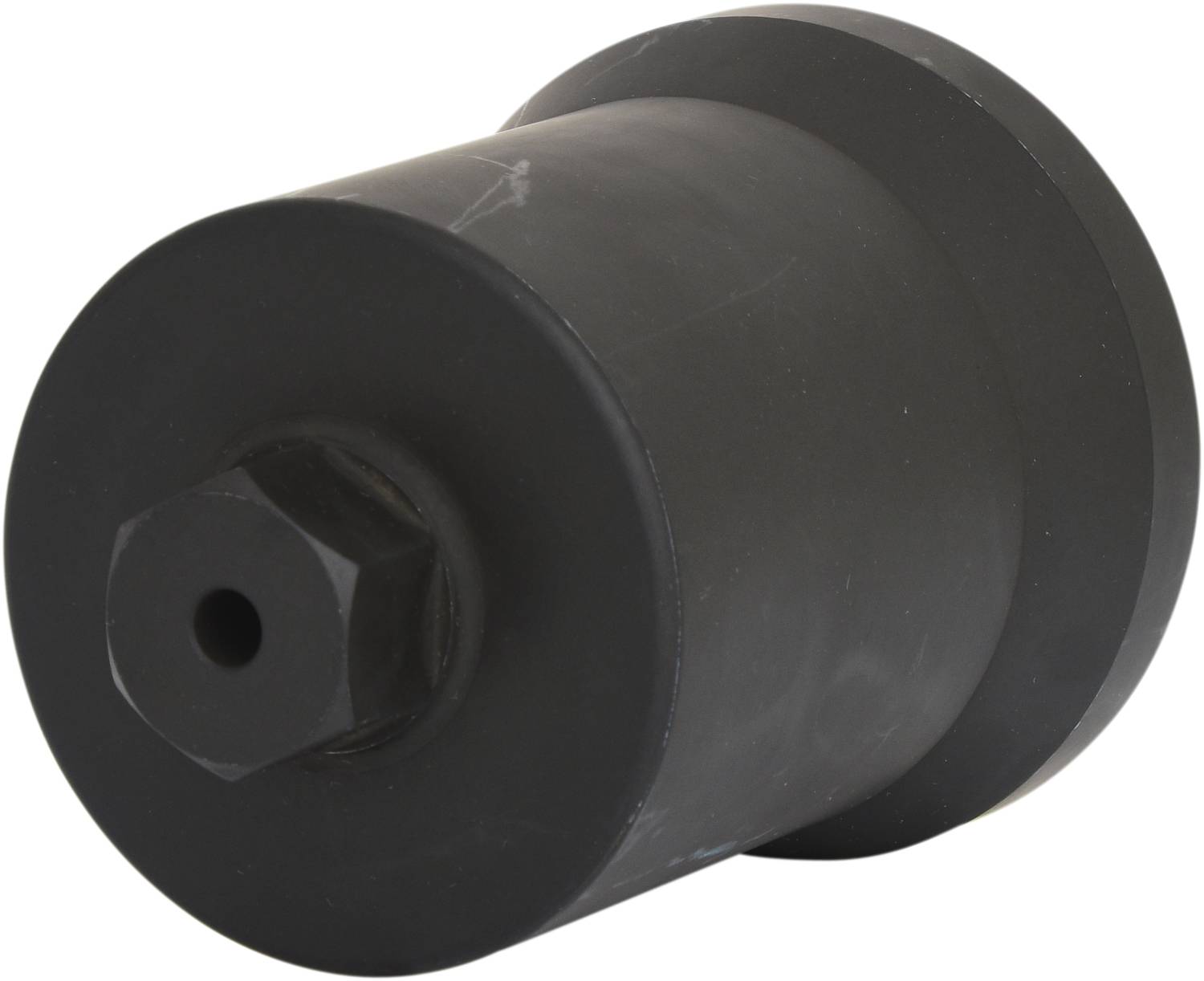 Black cylindrical metal object with a suggested hexagonal nut on one side, possibly a machine component.