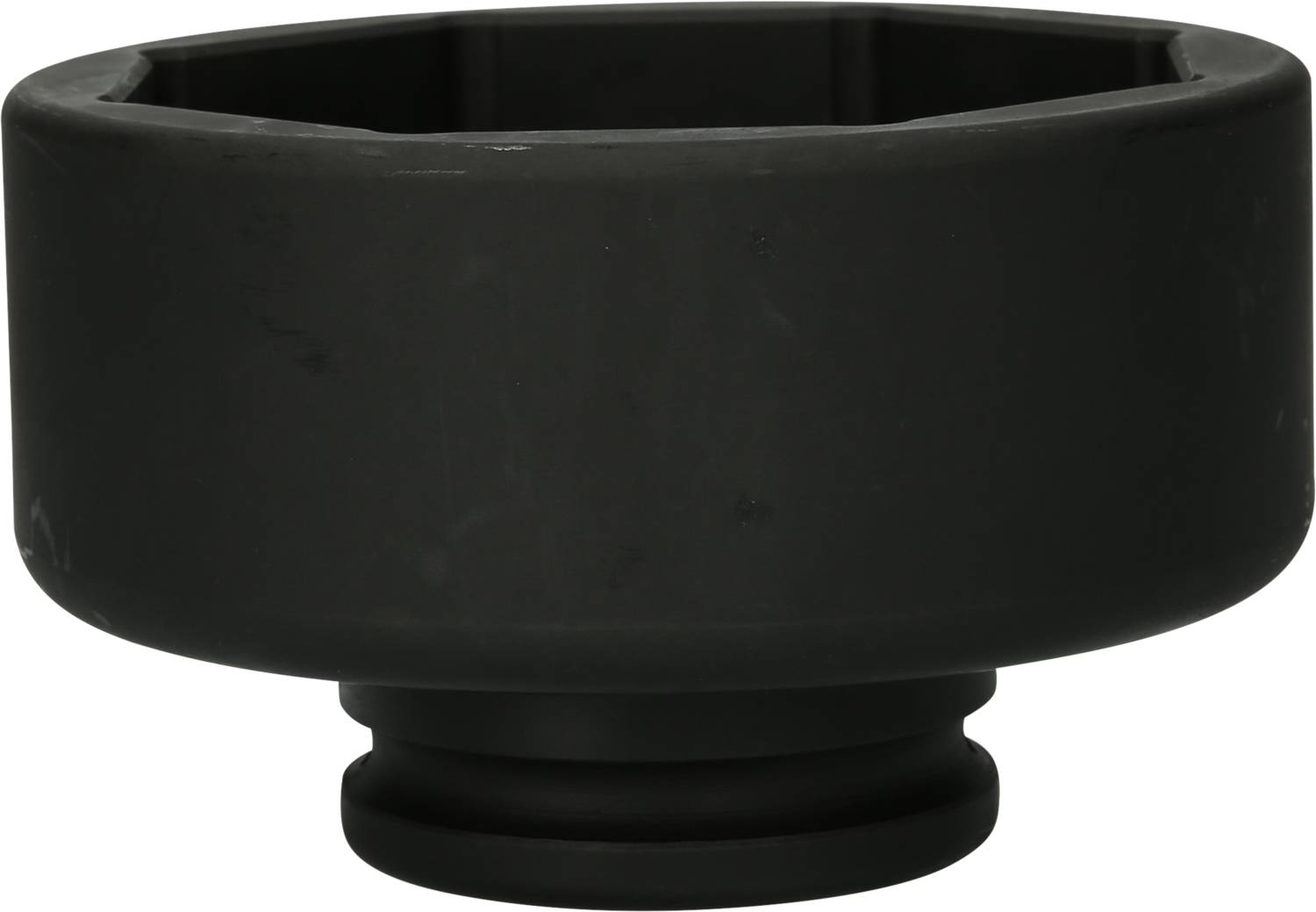 A black, cylindrical object with a broad top and narrower base, possibly an adapter or connector piece.