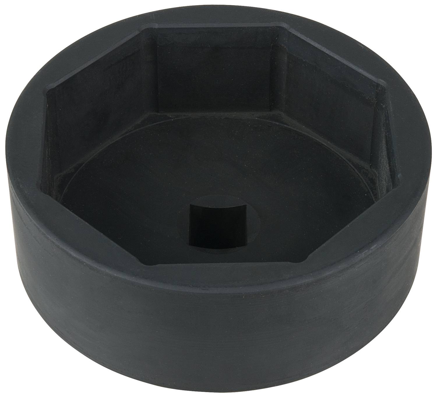 Black, hexagonal tool part with a central square opening, likely a large screw or nut cover.