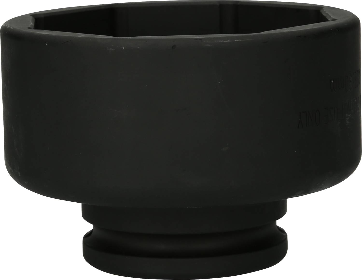 Black plastic piece, likely a car part such as a cap or cover, on a white background.