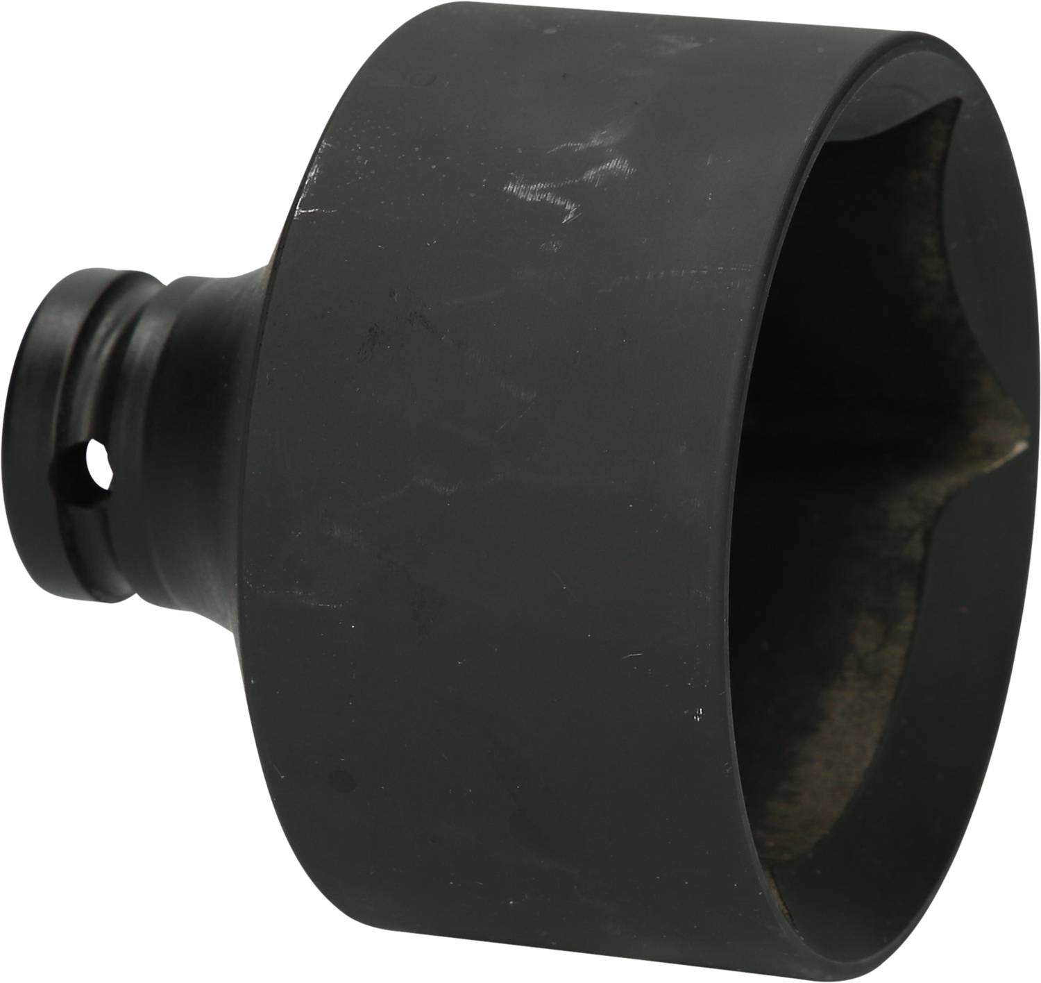 A black metal cylinder with a hole at the bottom, used for workshop applications or as a tool attachment.