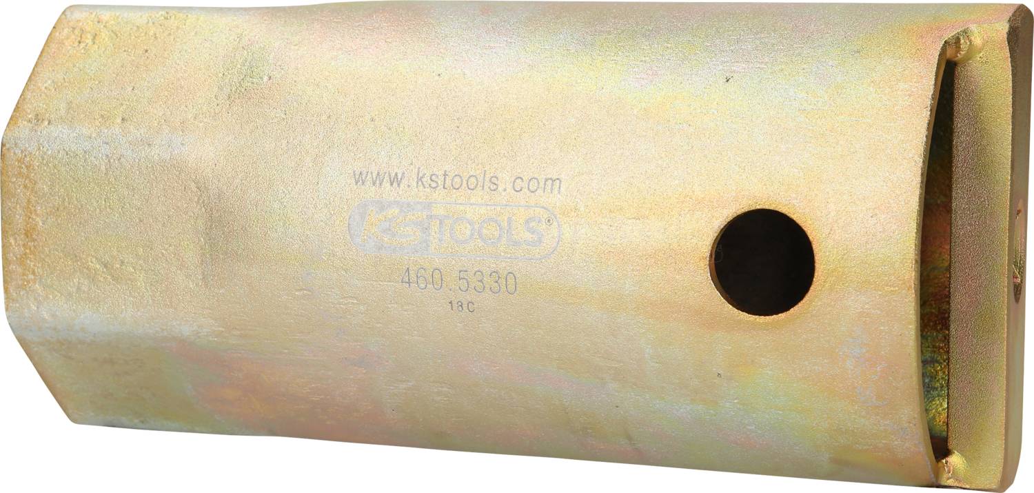 A cylindrical metal adapter with a hole and written markings. Probably a tool or part of a tool.