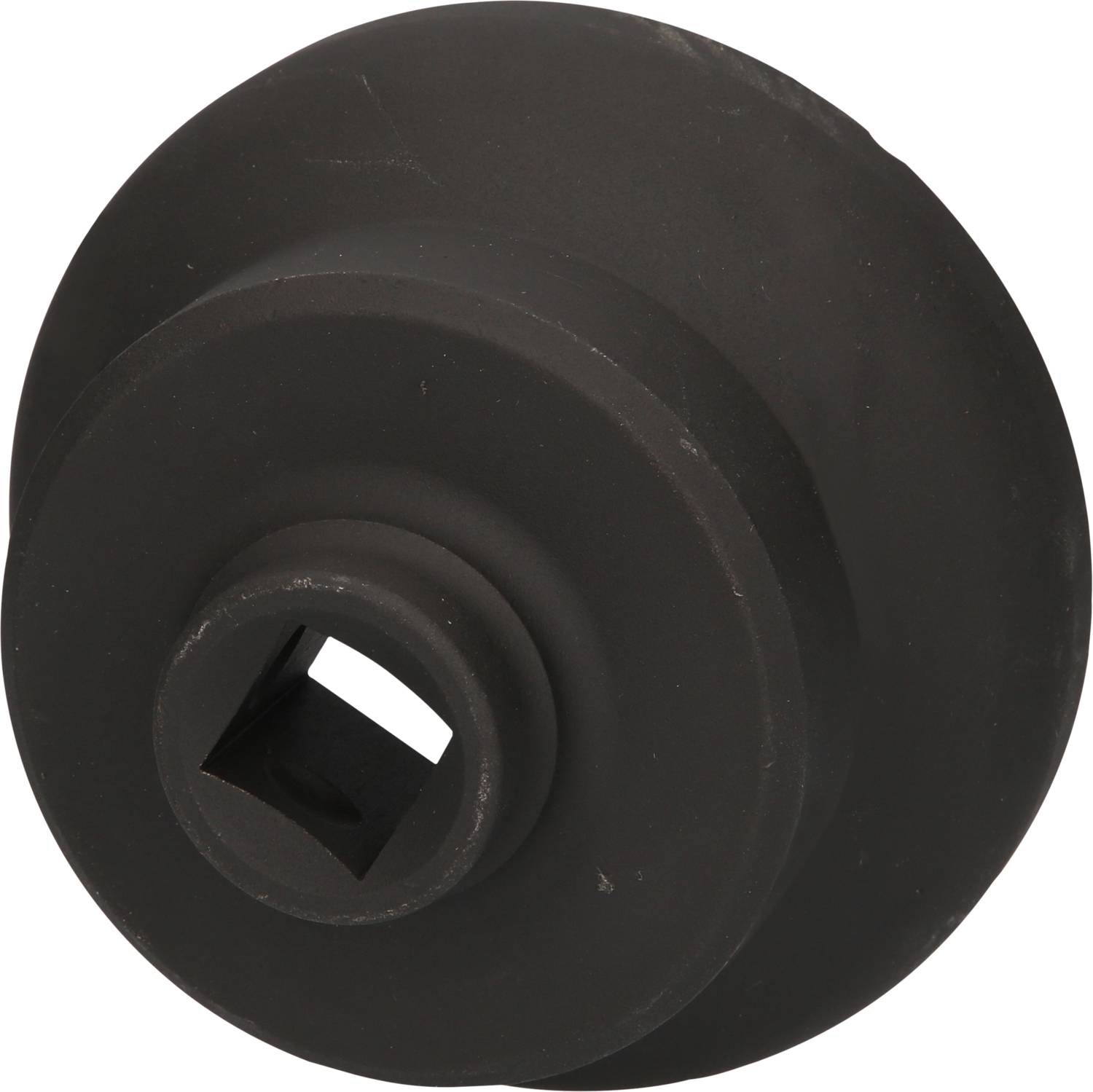 Black, round object with a square hole in the centre. Could be a machine part or a technical component.