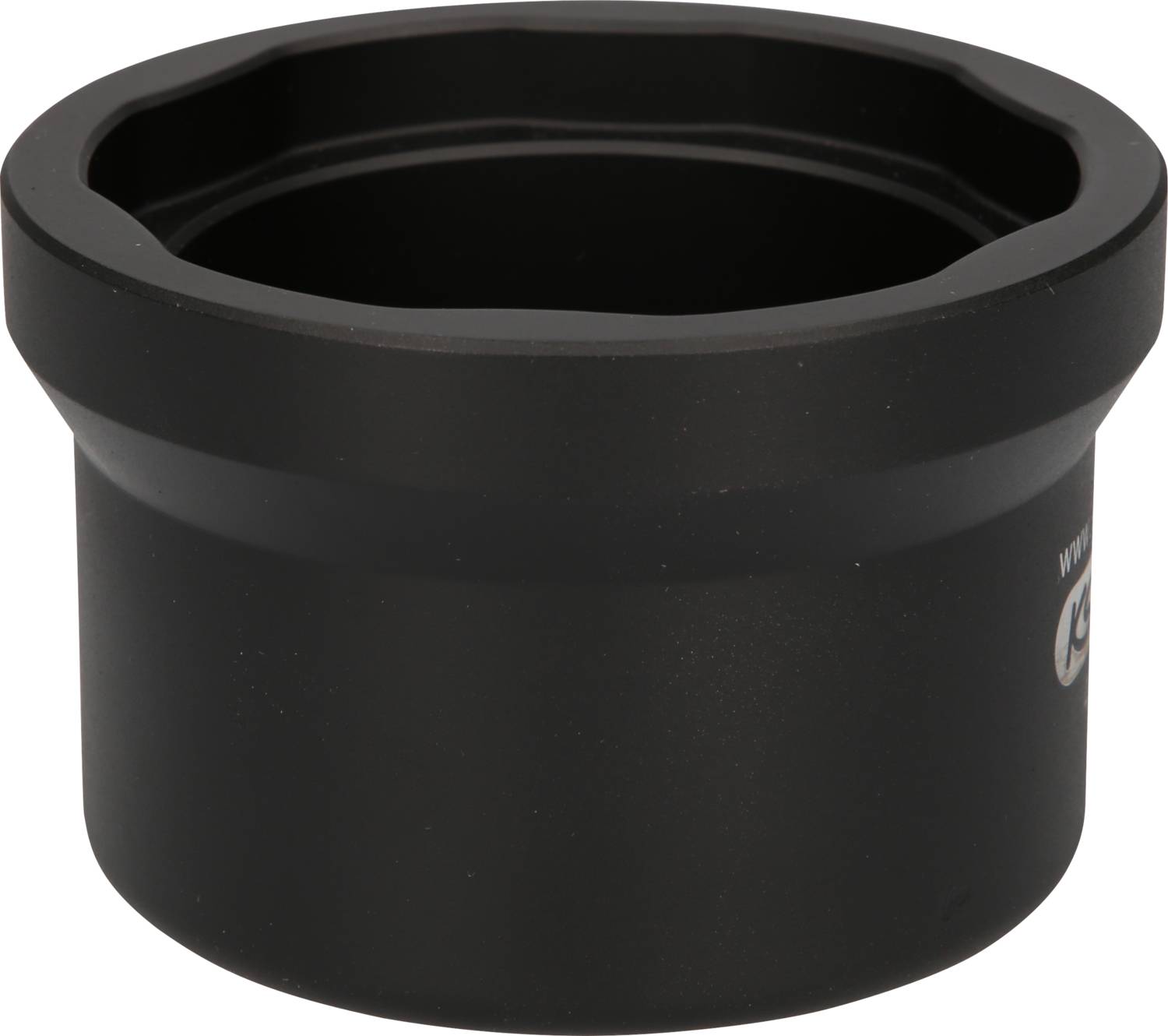 A black cylindrical metal component, possibly a machine part, with a smooth surface and grooved edge.