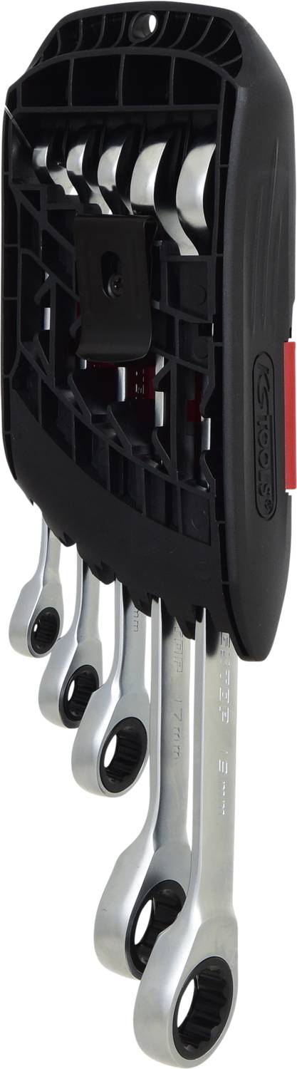 Set of four silver bit keys in a black holder, hanging vertically on a wall.