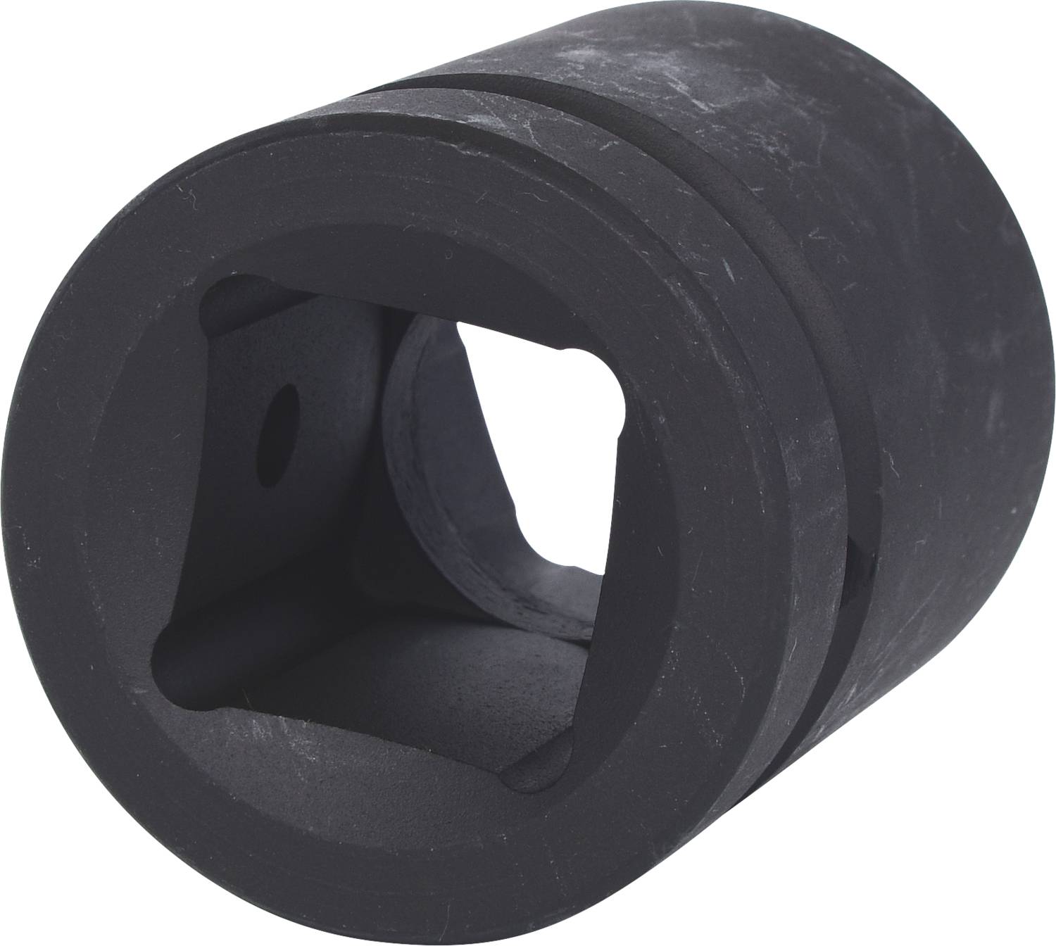 A black, cylindrical component with a square opening in the centre. Possibly part of a technical device or tool.