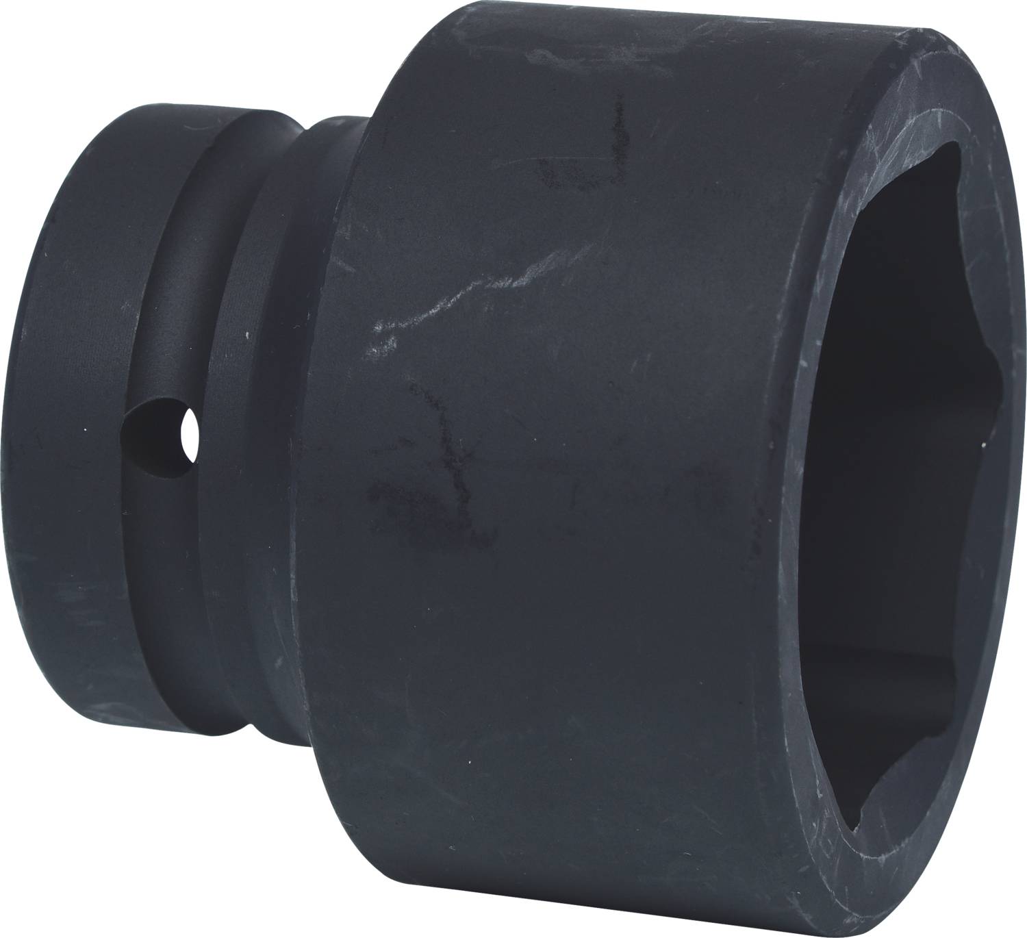Black plastic cylinder with an internal hexagonal shape and a side hole, potentially a tool or connecting element.