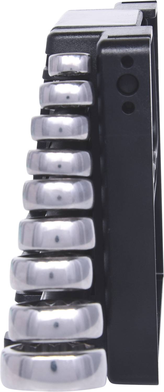 Metal rings stacked on a black device, photographed from the side.