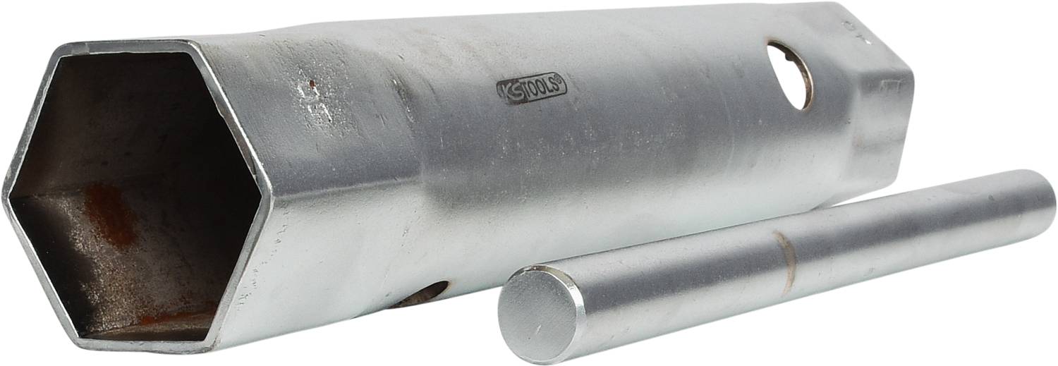 A silver hexagonal Allen key and a cylindrical metal tool are lying side by side on a white surface.