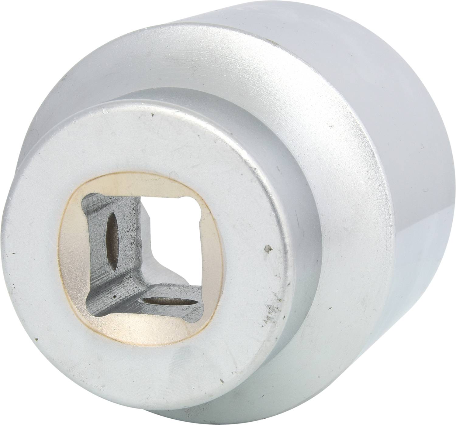 A silver, metallic adapter with a square opening, possibly for connecting tools to machines.