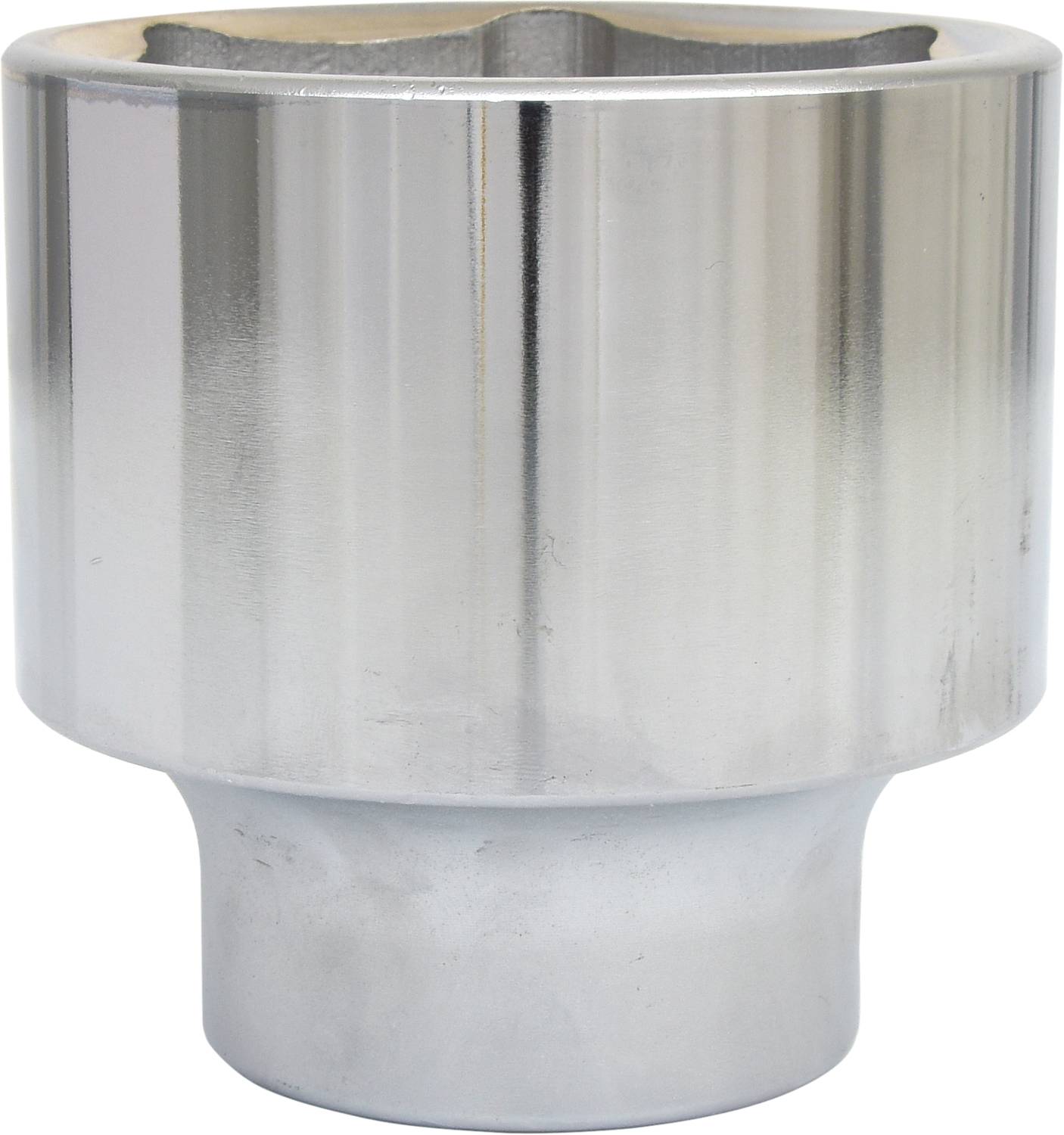 A silver cylinder key, cylindrical, with a hexagonal opening at the top and a smooth surface.