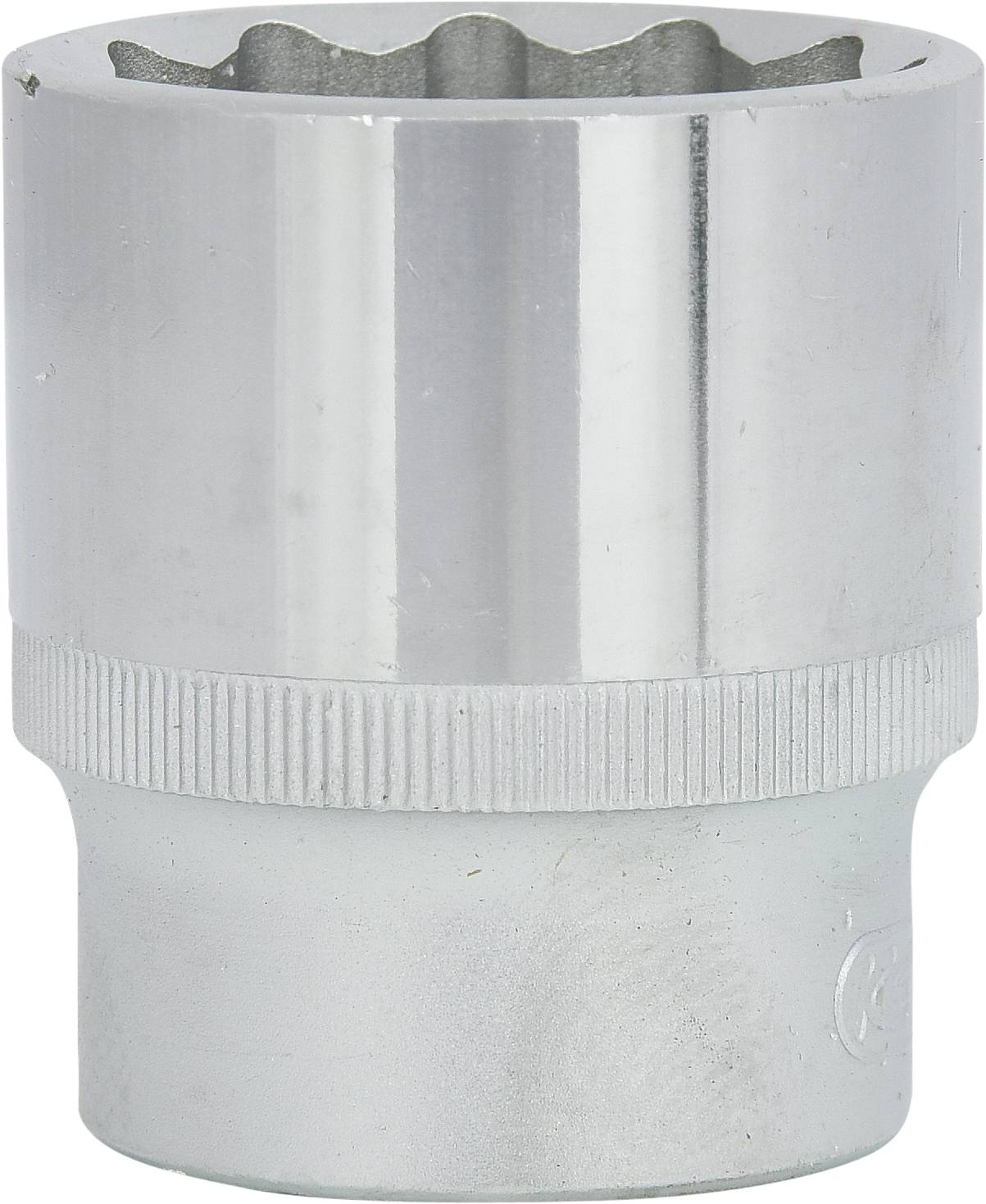 A silver hexagonal metal socket with a vertical surface, the upper edge featuring a zigzag pattern, and the lower half with a ribbed texture.