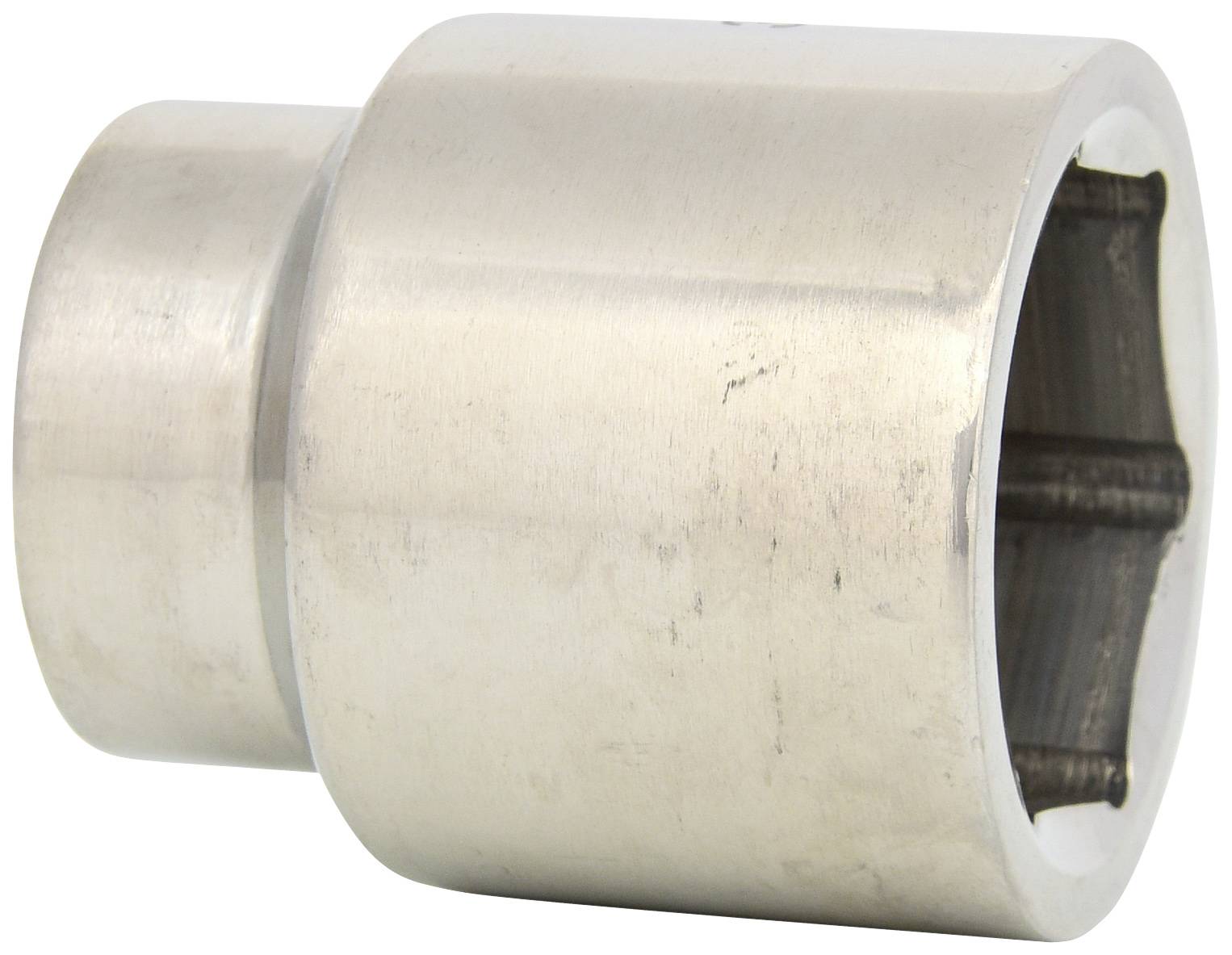 A silver-coloured metal socket extension, cylindrical with a hexagonal internal profile, lies on a white surface.