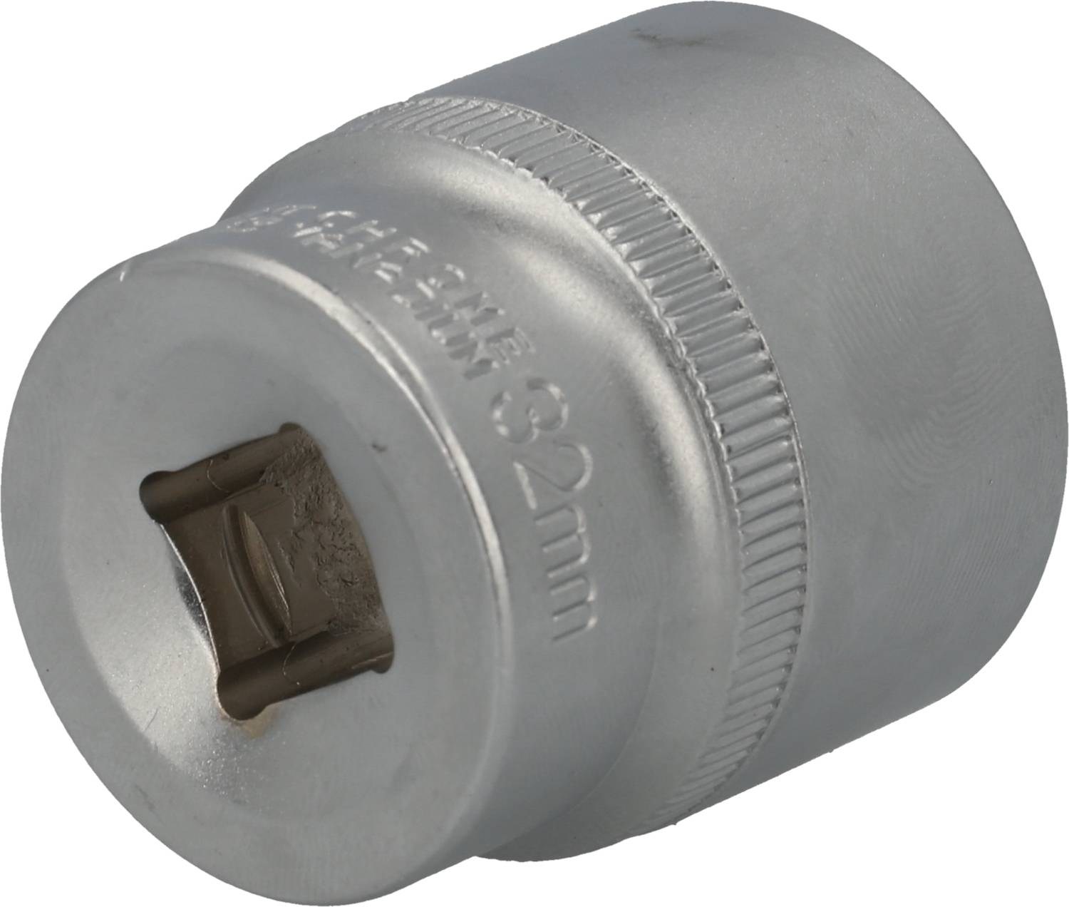 Metal socket extension with '82 mm' marking, used for repair or assembly work on vehicle or machine components.
