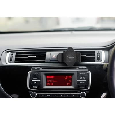 Car dashboard with radio display. Shows time as '14:44', FM radio switched on, station P2. Mobile phone holder in air vents.