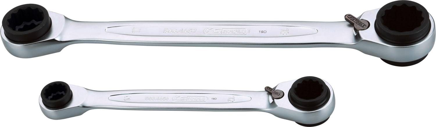Two silver ring spanners, one larger than the other, with ratchet mechanisms at both ends, set against a white background.