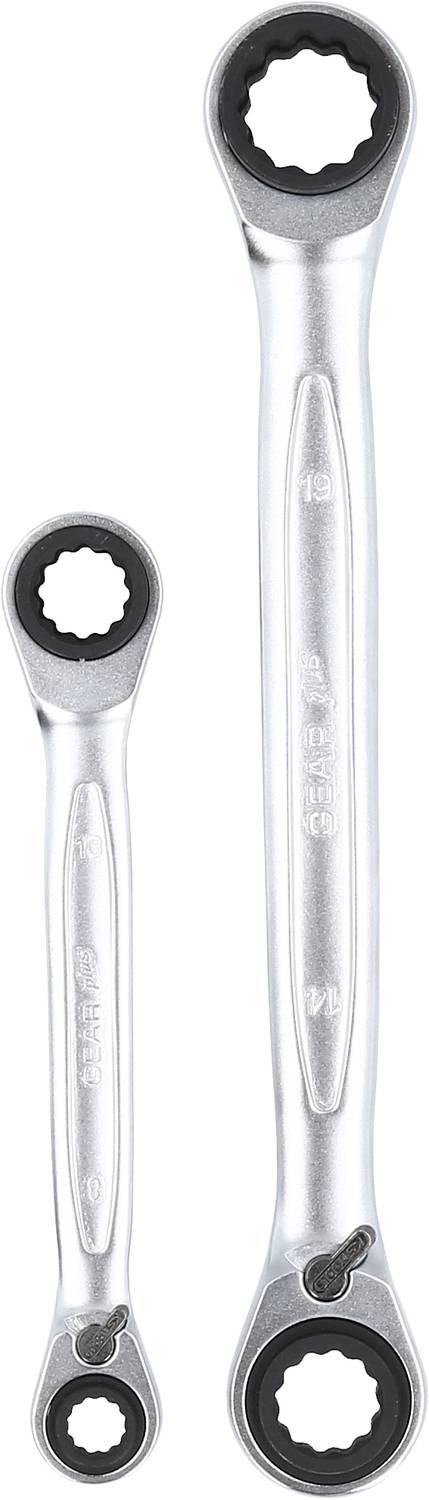 Two silver ring keys, of different sizes, on a white background.