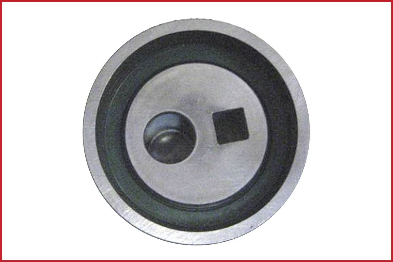 Metal disc with a circular and a square hole in the centre.