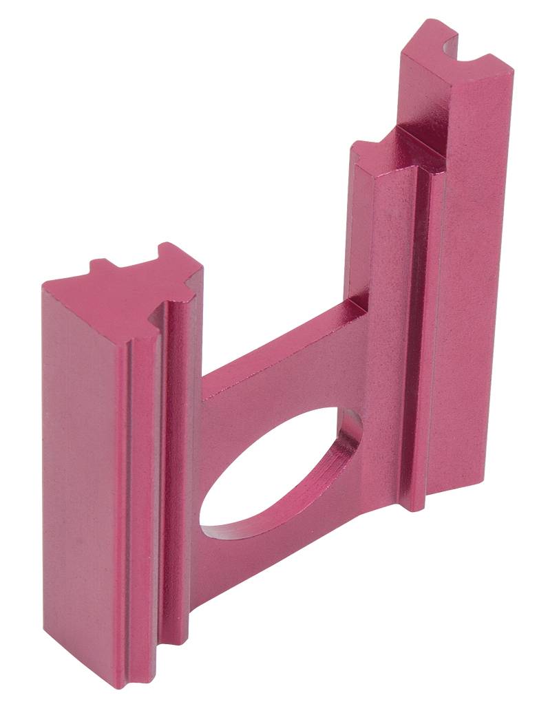 A red, rectangular metal component with multiple parallel edges and a central circular hole.