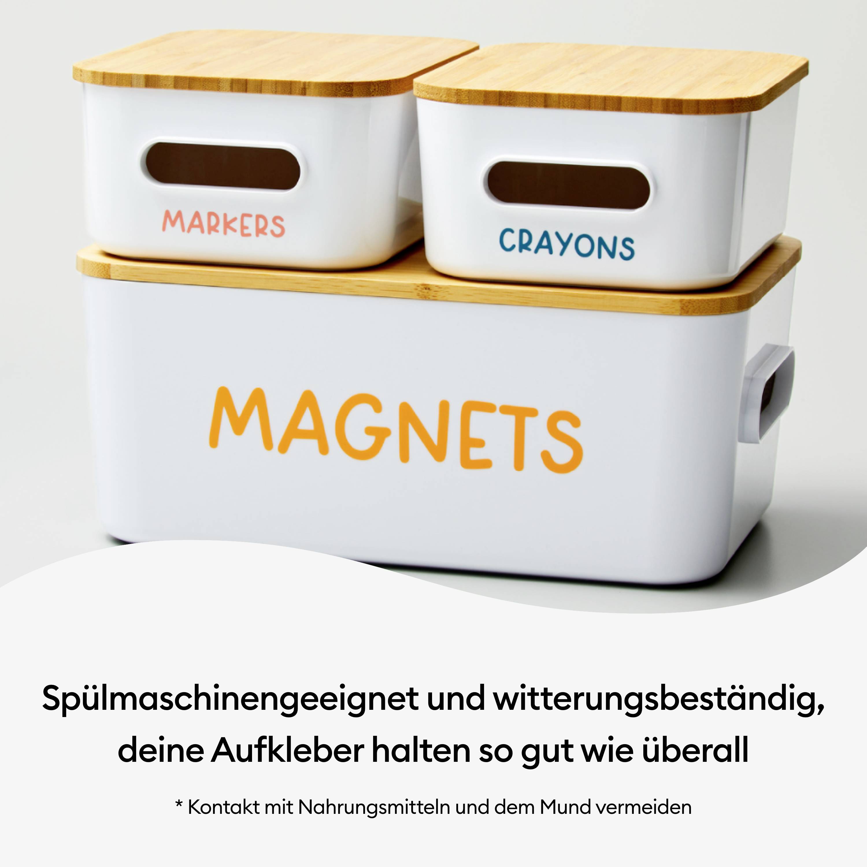 Plastic containers with wooden lids, labelled 'Markers', 'Crayons' and 'Magnets'. Text below: Dishwasher safe, weatherproof.
