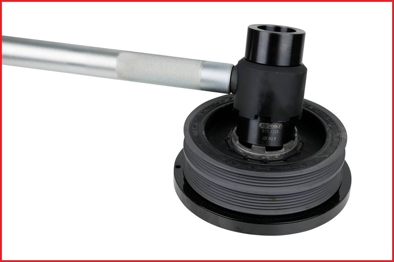 Black and grey mechanical tool with a long handle, possibly part of a machine or intended for loosening tight connections.