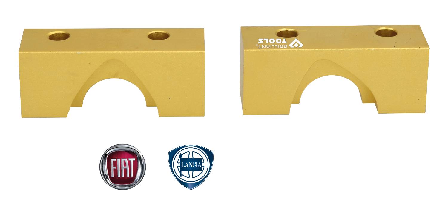 Two golden rectangular metal blocks with circular recesses and two holes each. Beneath them, the logos of Fiat and Lancia.
