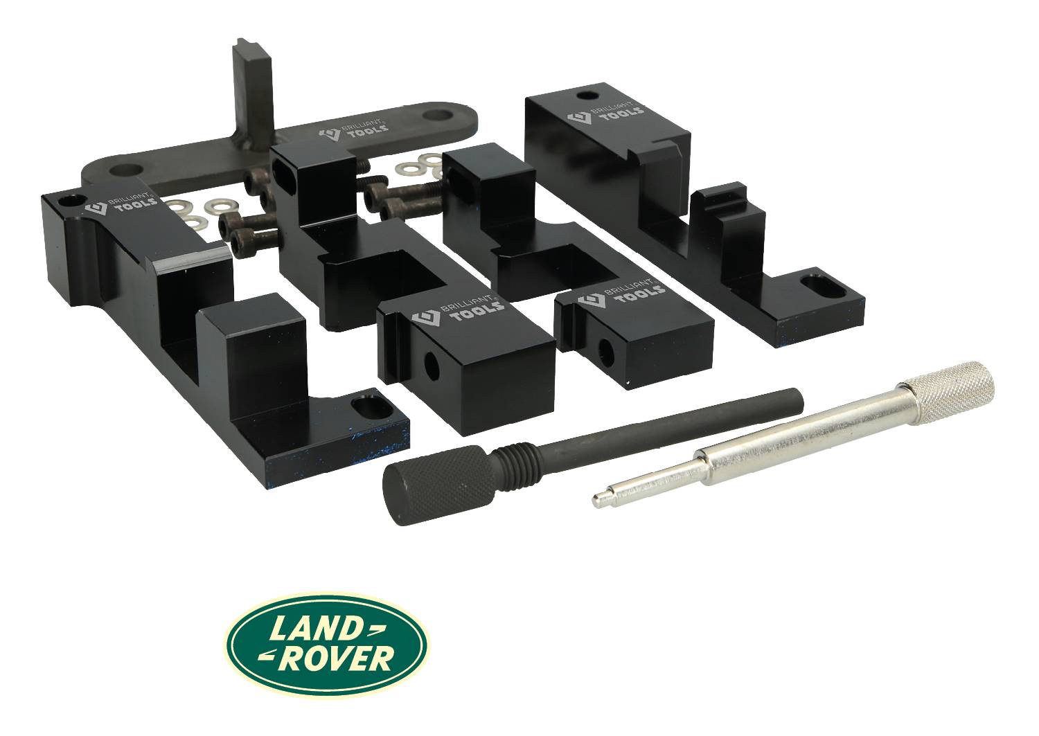 'Land Rover tool kit with various black metal parts and silver tools on a white background.'