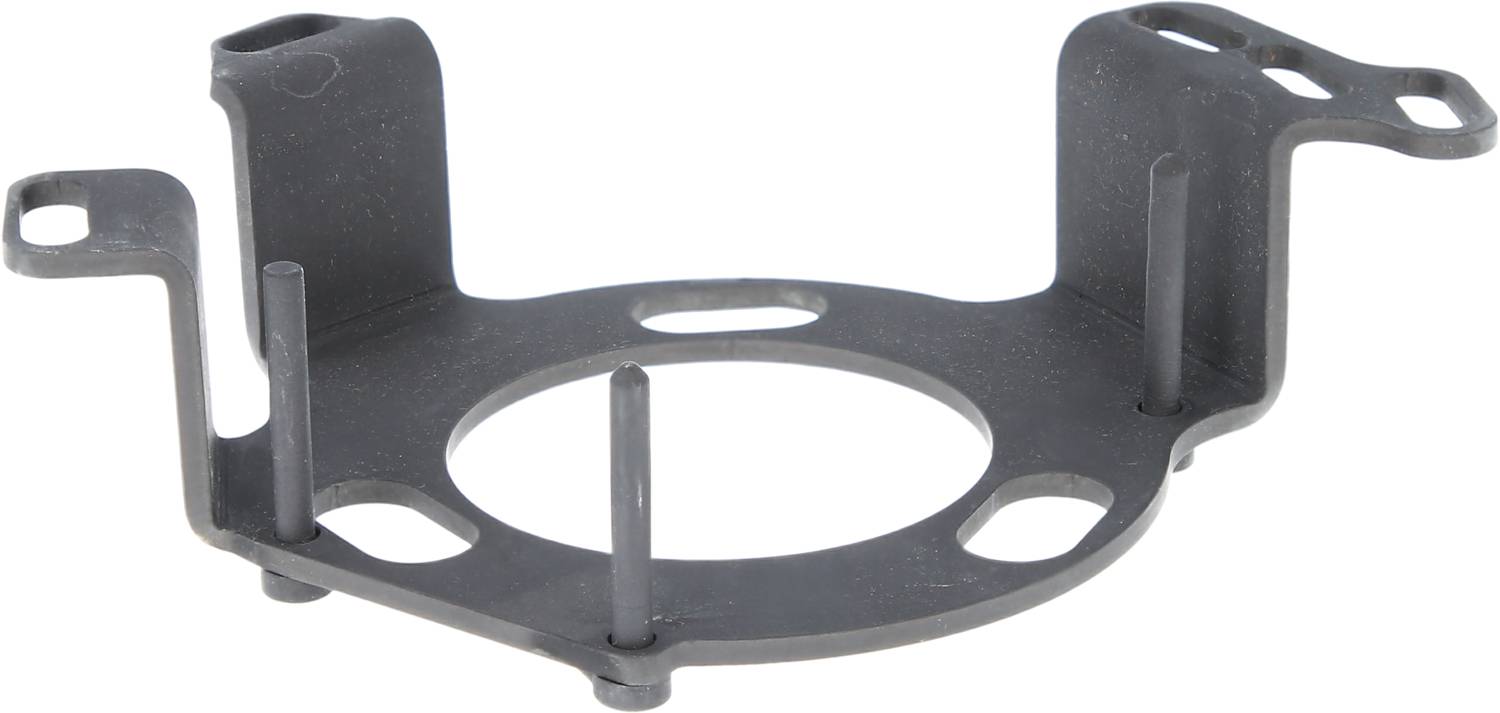 A round, grey metal part with holes and three vertical pins, possibly a mounting bracket or mounting plate.