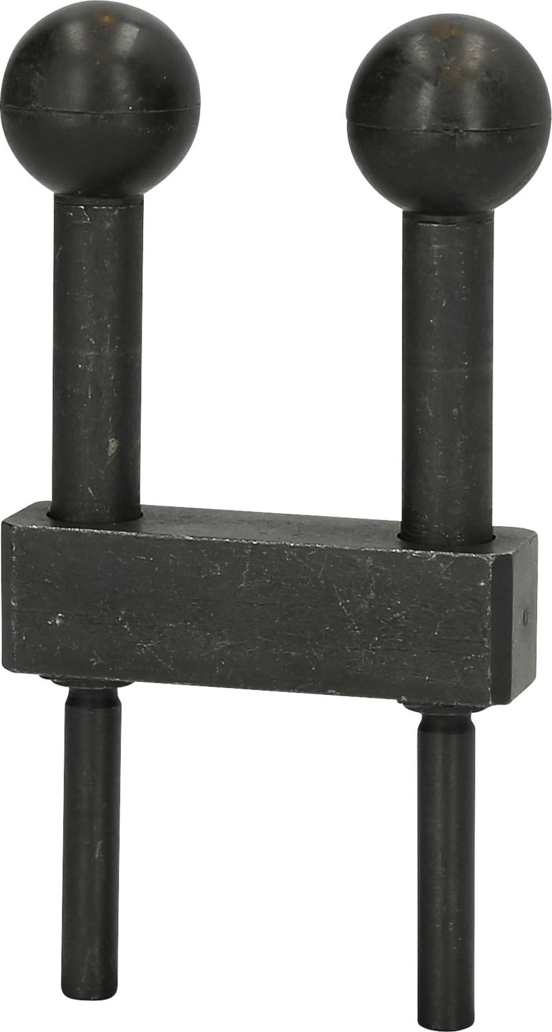 Black metal object with two vertical poles, each with a sphere at the top and a rectangular central section.