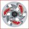 Metal disc with arrows indicating the direction of rotation; illustrates the functional mechanism of a clutch or rotational system.