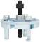 Metal three-legged bearing puller with central screw mechanism, used for removing parts from machinery.