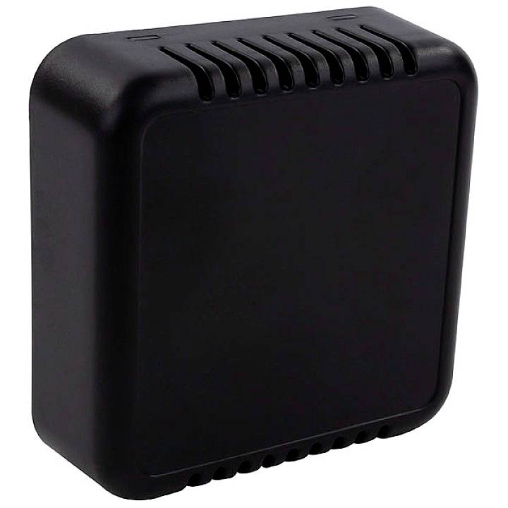 A black, square technical device with rounded corners and ventilation slots along the upper and lower edges.
