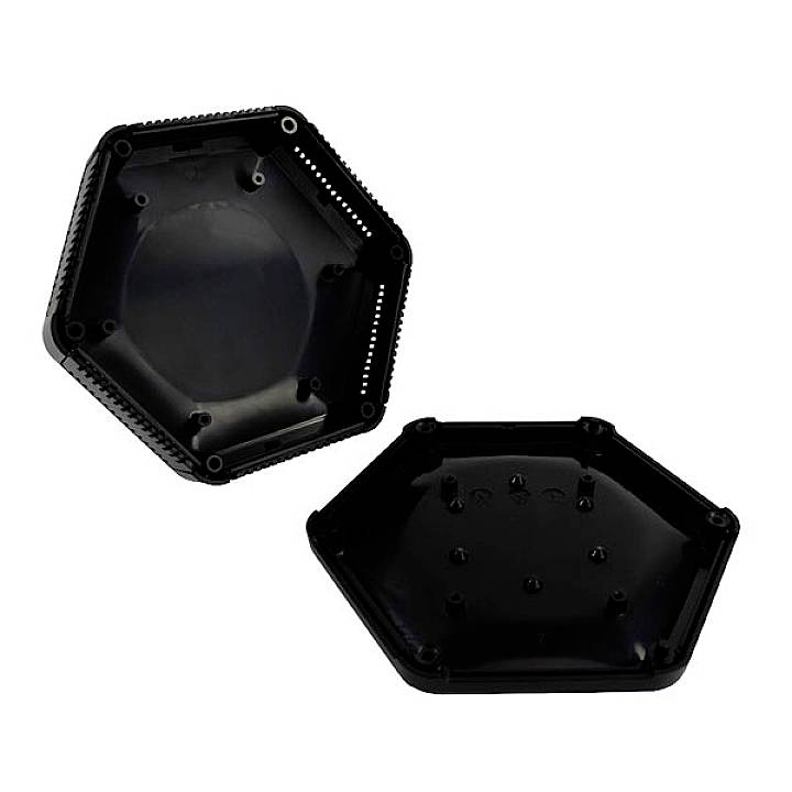 Two black, hexagonal plastic housing halves, one lying open, the other closed. They appear to be suitable for electronic devices.