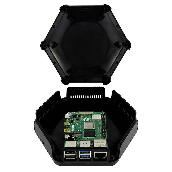 A Raspberry Pi computer in an opened, hexagonal black enclosure. USB ports and Ethernet port are visible.