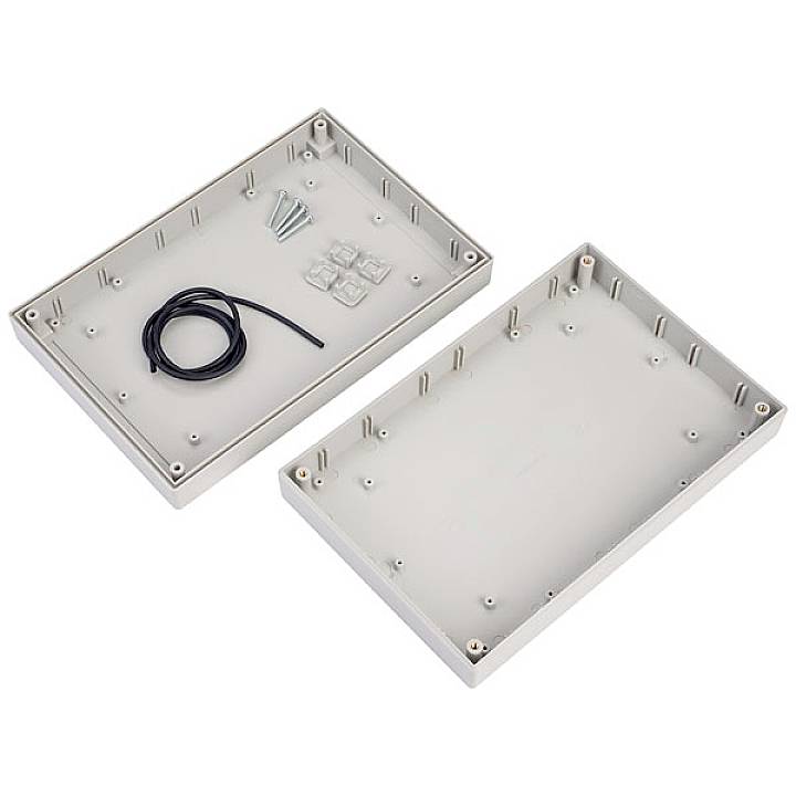 Open metal enclosure set with screws, cables, and rubber feet, suitable for mounting electronic components.