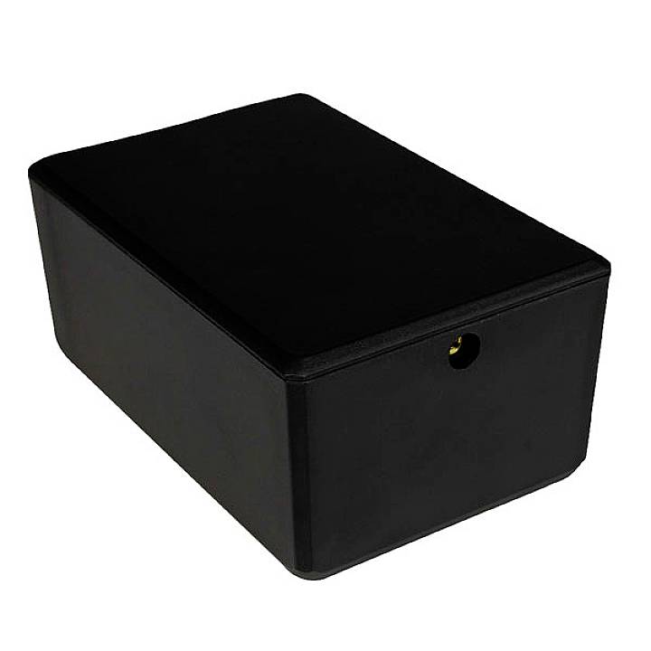 A black, rectangular plastic box with a small circular opening on one side.