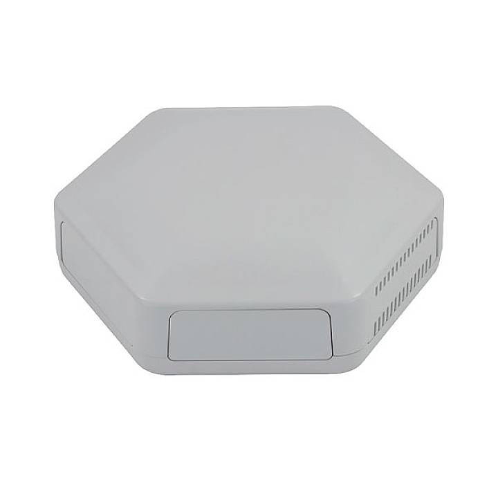 A hexagonal, grey device with smooth edges and slots on the sides, resembling a WiFi access point or router.