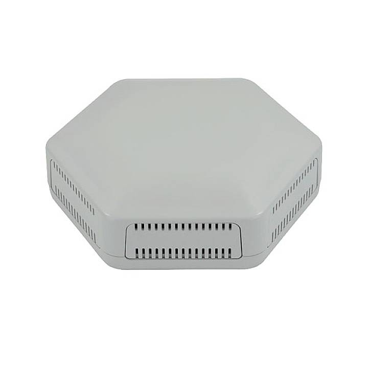 A grey, hexagonal device with ventilation slots. Likely an electronic device or cover.