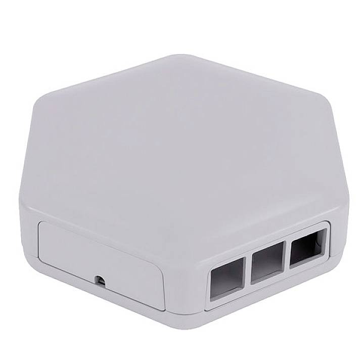 A white, hexagonal device with three rectangular openings on one side.