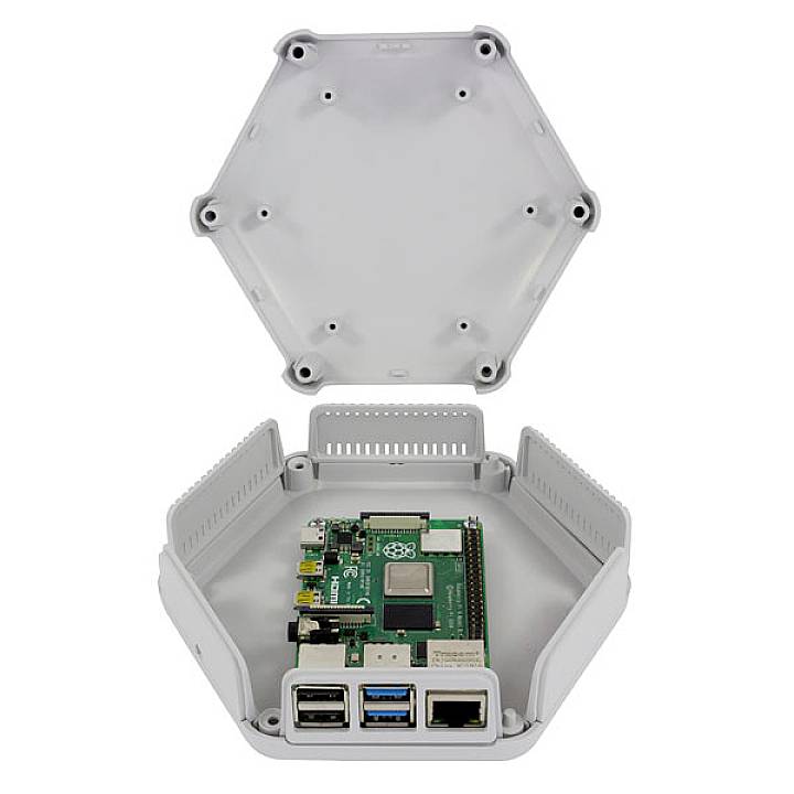 Open hexagonal enclosure with built-in single-board computer, front connections: USB, HDMI, Ethernet.