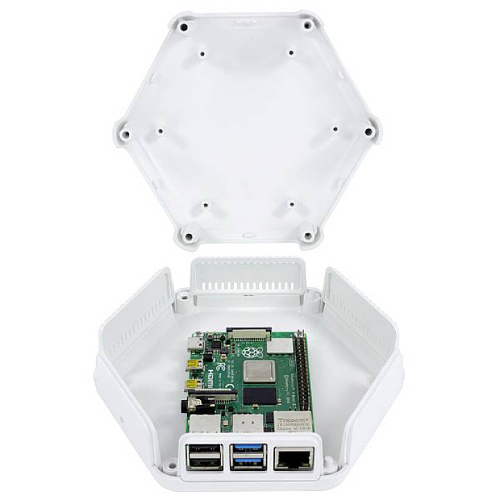 An open hexagonal enclosure reveals an integrated Raspberry Pi with Ethernet and USB ports.