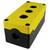 Yellow and black plastic enclosure with three round cutouts for mounting switch elements, used in electrical engineering.