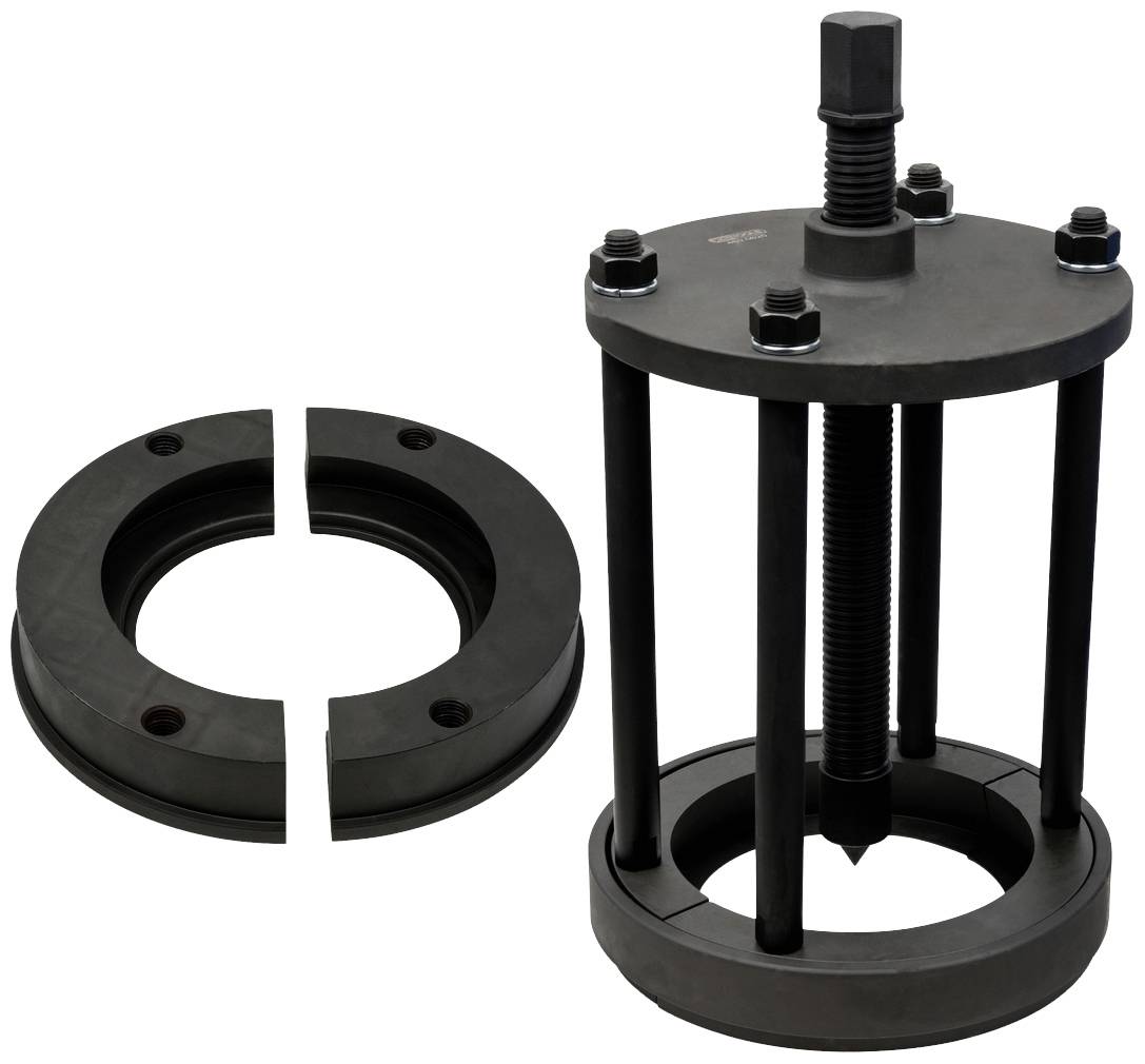 Large black pulling tool with a screw and locking nuts, alongside a split ring. Used to carefully draw parts apart.