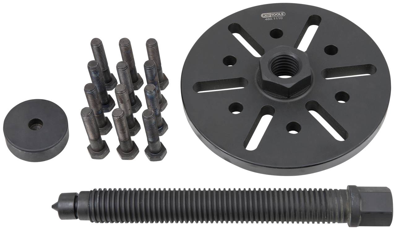 A puller set consisting of a large round plate with multiple screw holes, several screws, and a long bolt.