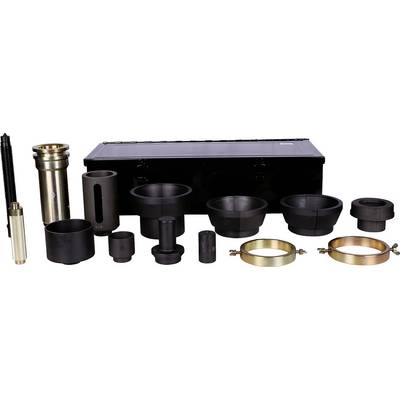 Various black and gold engineering components laid out in front of a black tool case.