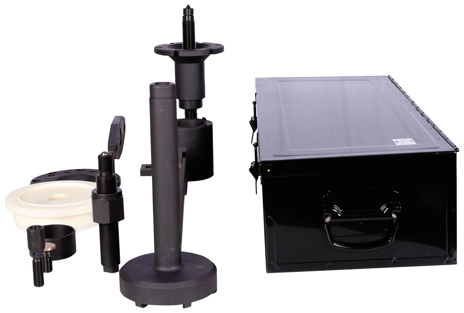 Various drill chucks and a black metal case on a white background. Drill accessories of different sizes on the left side of the image.