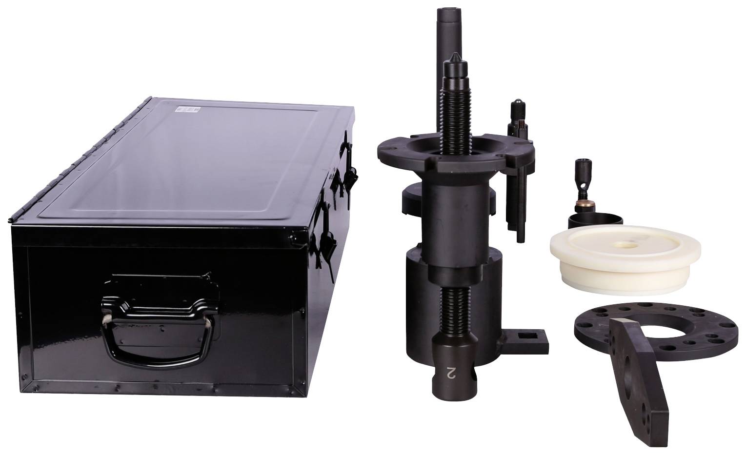 A black toolbox with an open lid, alongside a black precision tool and various discs and adapters.