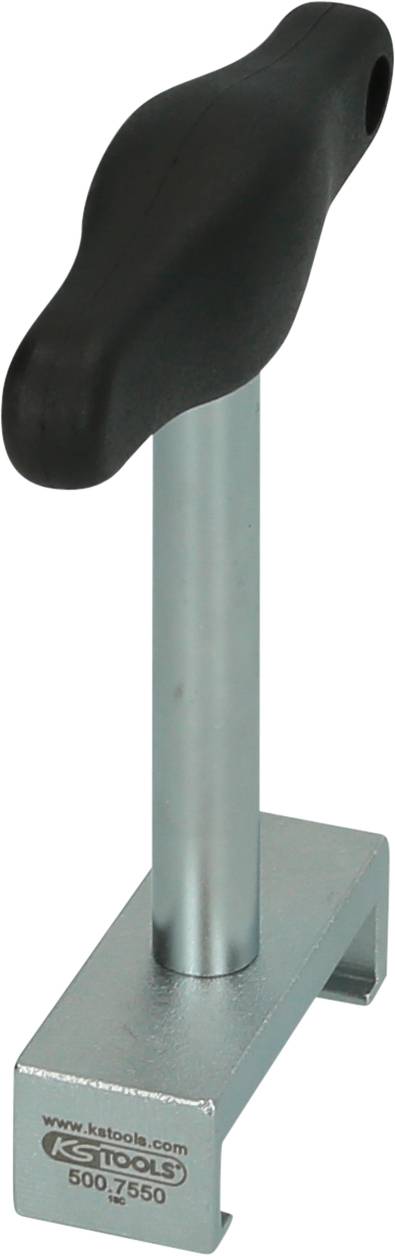 'T-grip screwdriver on metal block, suitable for turning or removing screws.'