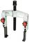 A puller tool with two hooks and two red turning knobs, used for removing bearings or gears from shafts.