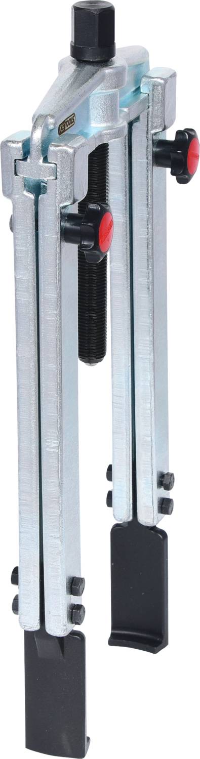 A metallic two-arm puller with red turning knobs, used for removing tight-fitting parts such as gears or bearings.